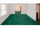 Bright living room with passage to dining room, complete with vibrant green carpeting at 3257 Georgian Woods Cir, Decatur, GA 30034