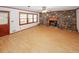 Bright living room with hardwood floors and stone fireplace at 3257 Georgian Woods Cir, Decatur, GA 30034