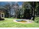 Overgrown in-ground pool with slide in a wooded yard at 3257 Georgian Woods Cir, Decatur, GA 30034