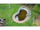 Aerial view of the backyard highlighting an in-ground swimming pool with a slide feature at 3257 Georgian Woods Cir, Decatur, GA 30034