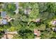 Aerial view of a tree covered lot with a cozy home and ample green space at 998 Northrope Ne Dr, Atlanta, GA 30324