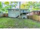 Exterior photo showing a deck, stairs, and yard area with a privacy fence at 1760 Spring Ave, Atlanta, GA 30344