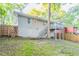 The backyard features a deck, stairs, a privacy fence, and a retaining wall at 1760 Spring Ave, Atlanta, GA 30344