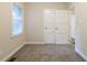 Bedroom featuring neutral walls, base molding, a window with blinds, and carpet at 1760 Spring Ave, Atlanta, GA 30344