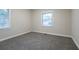 Bedroom featuring neutral paint, base molding, blinds, carpet, and a window at 1760 Spring Ave, Atlanta, GA 30344