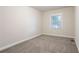 Bedroom featuring neutral walls, base molding, carpet, blinds, and a window at 1760 Spring Ave, Atlanta, GA 30344
