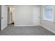 Bedroom featuring neutral walls, base molding, blinds, carpet, and a closet at 1760 Spring Ave, Atlanta, GA 30344