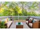 Wooden deck area with outdoor seating and green surroundings at 1760 Spring Ave, Atlanta, GA 30344