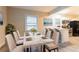 Modern dining area featuring a marble table and view of the kitchen and living room at 1760 Spring Ave, Atlanta, GA 30344