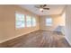 Open-concept living area features wood-look floors, large windows, and natural light at 1760 Spring Ave, Atlanta, GA 30344