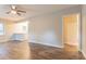 View of a spacious living room with wood floors and open access to a kitchen at 1760 Spring Ave, Atlanta, GA 30344