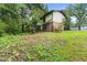 Backyard featuring mature trees and grass at 2501 Northbrook Rd, Snellville, GA 30039
