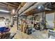 Unfinished basement with exposed ceiling, concrete floors, and shelving at 2501 Northbrook Rd, Snellville, GA 30039