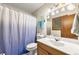 Renovated bathroom with bright lighting, tile flooring, and large vanity at 2501 Northbrook Rd, Snellville, GA 30039