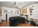 Bedroom featuring wood-look floors, a ceiling fan, and unique decor at 2501 Northbrook Rd, Snellville, GA 30039