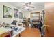 Bedroom with laminate flooring, ceiling fan, and natural light from the window at 2501 Northbrook Rd, Snellville, GA 30039
