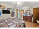Bedroom boasts a ceiling fan, hardwood flooring, and a view of the dresser at 2501 Northbrook Rd, Snellville, GA 30039