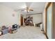 Bright dining room with ceiling fan, vintage flooring, and natural light coming from a side window at 2501 Northbrook Rd, Snellville, GA 30039