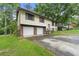 Classic split-level home with a two-car garage at 2501 Northbrook Rd, Snellville, GA 30039