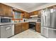 Well-equipped kitchen featuring stainless steel appliances and ample cabinets at 2501 Northbrook Rd, Snellville, GA 30039