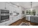 Modern kitchen featuring white cabinets, stainless steel appliances, and hardwood flooring at 1143 Brookhaven North Cir, Brookhaven, GA 30319