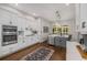 Modern kitchen featuring white cabinets, stainless steel appliances, and hardwood flooring at 1143 Brookhaven North Cir, Brookhaven, GA 30319