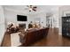 Spacious living room with hardwood floors, fireplace, ceiling fan, and open floor plan at 1143 Brookhaven North Cir, Brookhaven, GA 30319