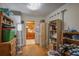 Hallway with hardwood floors and cluttered shelving at 207 Walthall Nw St, Marietta, GA 30064