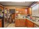 Well-equipped kitchen featuring granite countertops and wood cabinets at 207 Walthall Nw St, Marietta, GA 30064