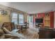 Bright living room with hardwood floors, comfortable seating, and ample natural light at 207 Walthall Nw St, Marietta, GA 30064