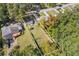 Property lot lines, highlighting its expansive yard with mature trees, patio area, and multiple parking spaces at 2776 Grand Ave, Atlanta, GA 30315