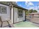 A backyard with newly painted exterior, wood deck, and manicured green lawn at 2776 Grand Ave, Atlanta, GA 30315