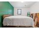 Bedroom featuring painted accent wall, window, hardwood floors and ceiling fan at 2776 Grand Ave, Atlanta, GA 30315