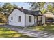 View of home with quaint covered entryway, nice yard and convenient driveway at 2776 Grand Ave, Atlanta, GA 30315