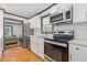 This kitchen offers stainless steel appliances, quartz countertops, white cabinets, and an open concept at 2776 Grand Ave, Atlanta, GA 30315