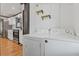 Kitchen adjacent to the laundry area with white washer and dryer at 2776 Grand Ave, Atlanta, GA 30315