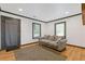 Cozy living room featuring hardwood floors, a gray couch, and ample natural light at 2776 Grand Ave, Atlanta, GA 30315