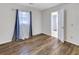 Bedroom with lots of natural light, new hardwood floors, and freshly painted walls at 333 Lynne Cir, Alpharetta, GA 30009