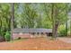 Charming one-story brick home with large, mature trees, lovely greenery and a nice front yard at 333 Lynne Cir, Alpharetta, GA 30009