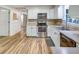 Kitchen boasts stainless steel appliances, lots of counter space, hardwood floors and a window over the sink at 333 Lynne Cir, Alpharetta, GA 30009