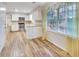 Bright kitchen with stainless steel appliances, eat-in area, lots of natural light and hardwood floors at 333 Lynne Cir, Alpharetta, GA 30009