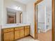 Bright bathroom features wood cabinets, a spacious vanity, and accessible shower at 1554 Owens Store Road Rd, Canton, GA 30115