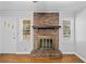 Close-up of the brick fireplace in the living room, a focal point of the space at 1554 Owens Store Road Rd, Canton, GA 30115