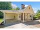 Charming single-story home with a covered entry and attached carport at 1554 Owens Store Road Rd, Canton, GA 30115