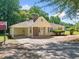 Charming one-story home with a covered carport, tidy landscaping, and freshly paved driveway at 1554 Owens Store Road Rd, Canton, GA 30115
