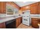 Updated kitchen with stainless steel appliances, wood cabinetry, and a cozy breakfast nook at 1554 Owens Store Road Rd, Canton, GA 30115