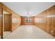 Large living room with natural wood and easy access to other rooms and exterior at 1554 Owens Store Road Rd, Canton, GA 30115