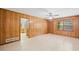 Inviting living room featuring wood accents, a window, and an access door at 1554 Owens Store Road Rd, Canton, GA 30115