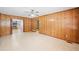 Cozy living room with charming wood paneling and easy flow to other spaces at 1554 Owens Store Road Rd, Canton, GA 30115