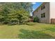Spacious backyard with a well-maintained lawn, established trees, and a home's exterior at 2145 Kensington Sw Ct, Marietta, GA 30064